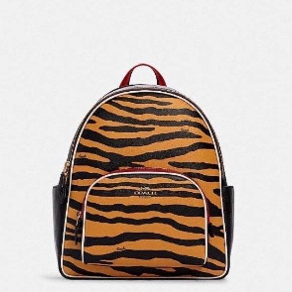 coach backpack with tiger Court in Signature Canvas C7317 Printed coated canvas and refined pebble leather Inside zip and multifunction pockets Double zip closure fabric lining Handle with 2 1/4 drop Outside zip pocket Adjustable shoulder straps 10 3/4 (L) x 12 1/2 (H) x 4 3/4 (W) Style No. Coach Animal Print Backpacks for